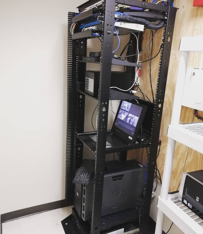 An equipment rack installed at a church, with network switch, UPS and a rack-mounted monitor